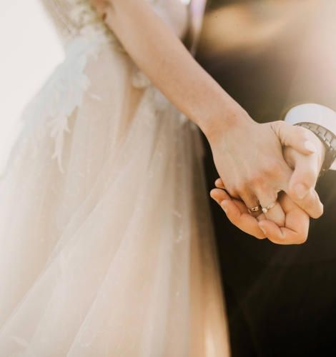 Newlywed Couple Holding Hands